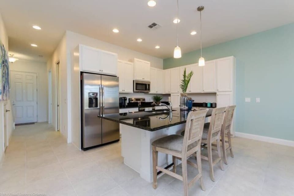 - Large kitchen with island seating modern appliances and bright space
- Well stocked kitchen designed for longer stays and family meals
- Myrtle Beach condo kitchen with open layout and easy access  