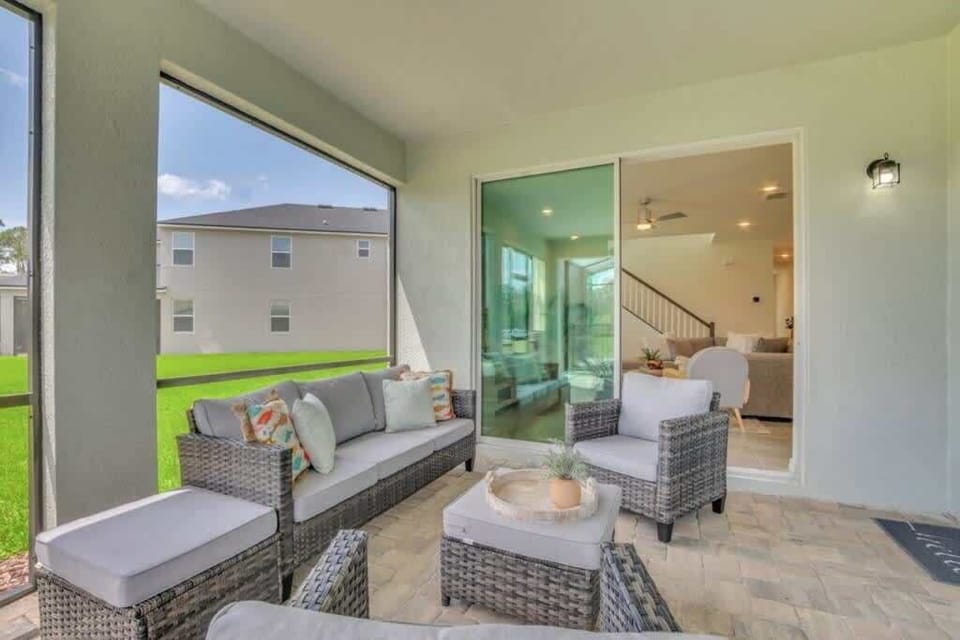 - Covered patio seating indoor outdoor flow for relaxing evenings
- Outdoor lounge with cushioned chairs near pool and living room
- Vacation rental patio for coffee chats and fresh air downtime
