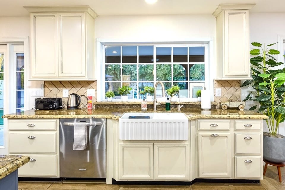 Dishwasher, farmhouse sink and plenty of counter and storage space