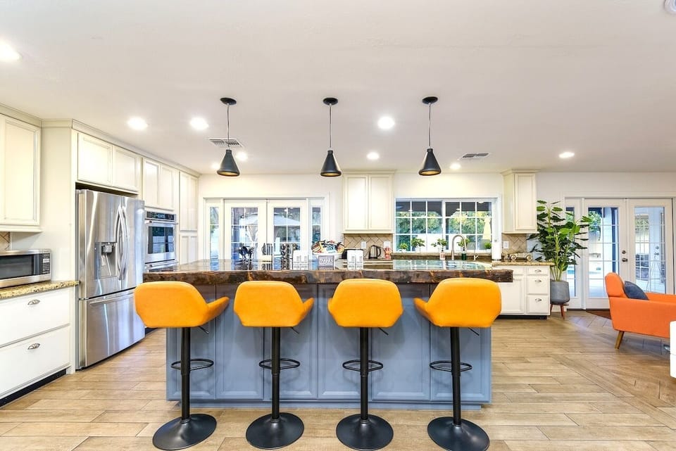 Fully stocked kitchen with bar seating for four