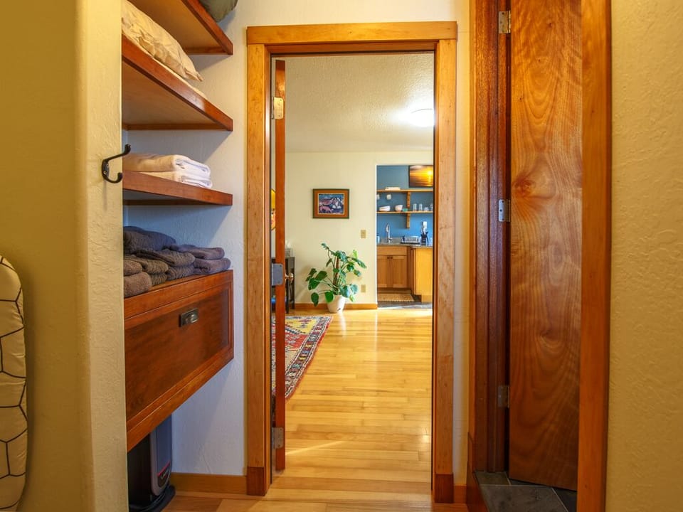 Hallway door separates bathroom/bedroom from living room and kitchen.