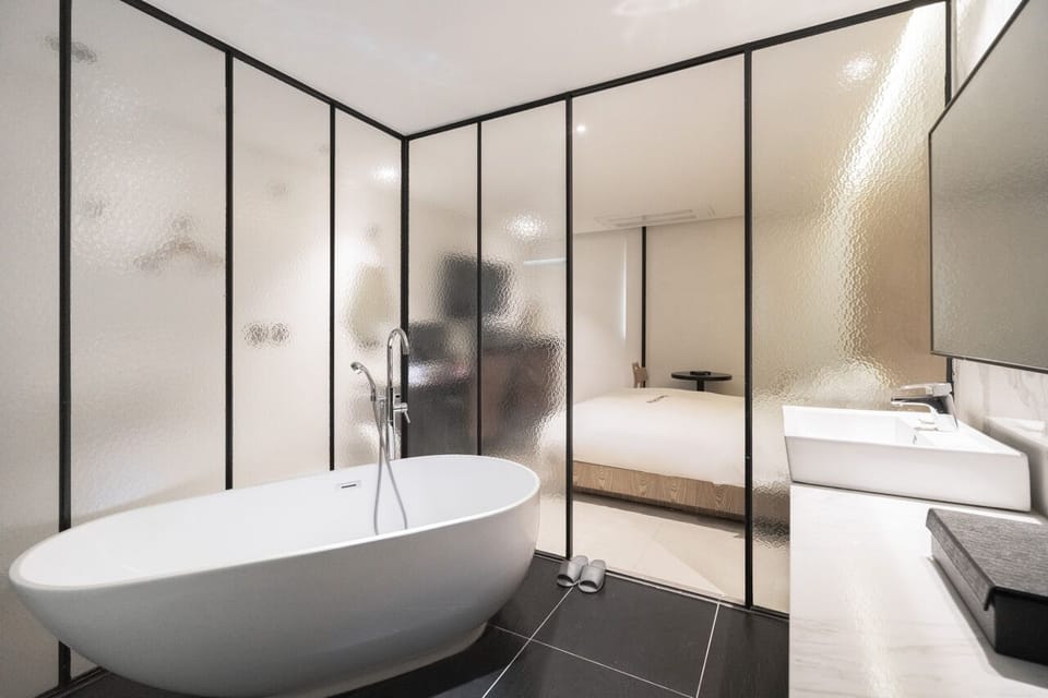 Separate tub and shower, hair dryer, bathrobes, slippers