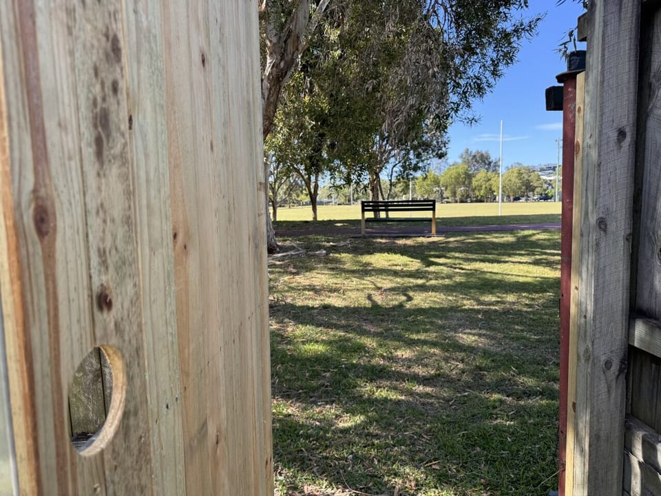 Exit to the park past the tiny home.