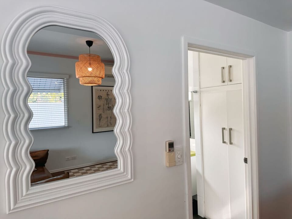 Here’s a complete description for the main bedroom:  Main Bedroom - Spacious Retreat with Walk-In Wardrobe and Ensuite  Unwind in the comfort of the main bedroom, a true retreat within our Queenslander home. This inviting space features a generous walk-in