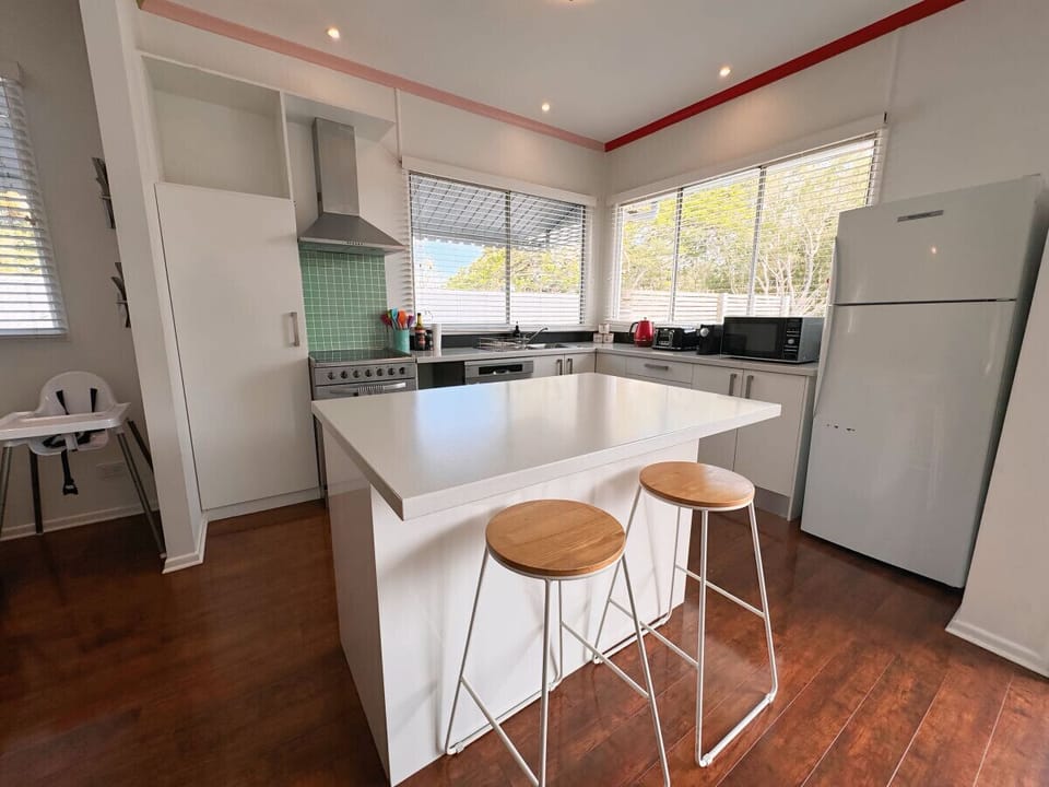 Full Kitchen - Equipped for Your Culinary Needs  Our spacious, fully equipped kitchen has everything you need to prepare meals with ease. Enjoy a large fridge, stove, and microwave, along with a selection of pots, pans, and all the essentials, including a