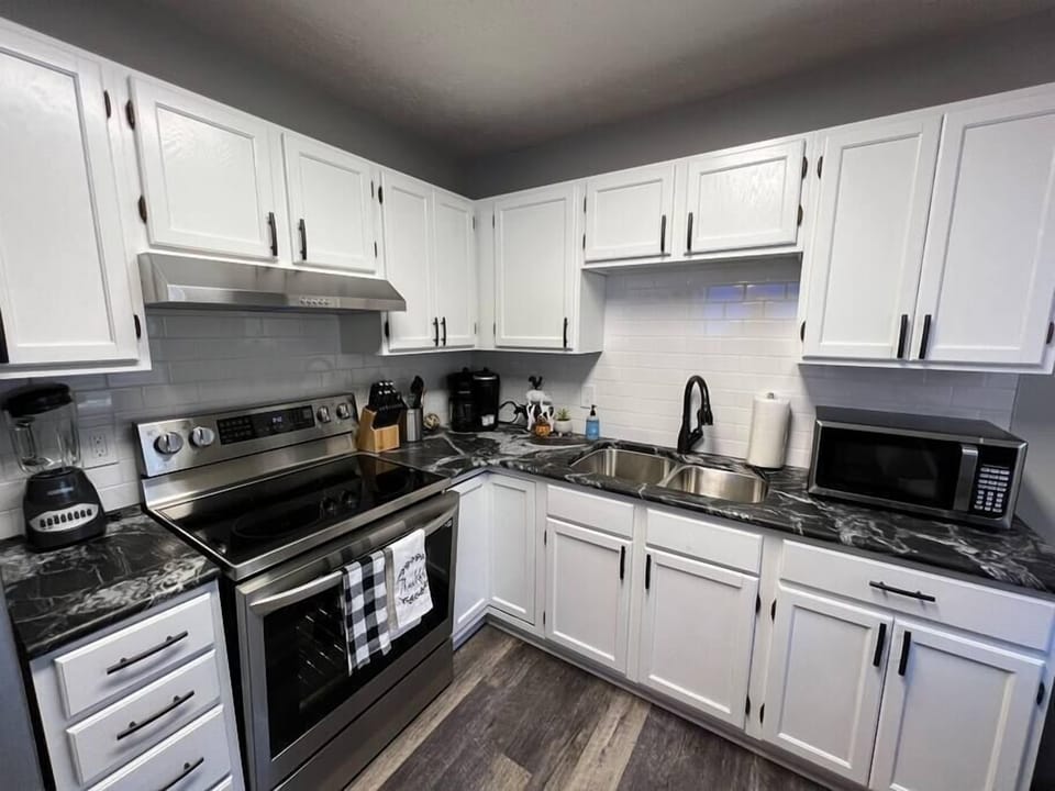 Beautifully remodeled kitchen with granite counters and high quality stainless steel appliances.