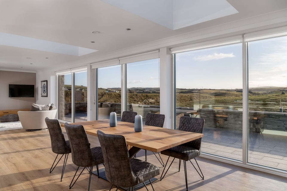 Dining area with floor to ceiling windows 