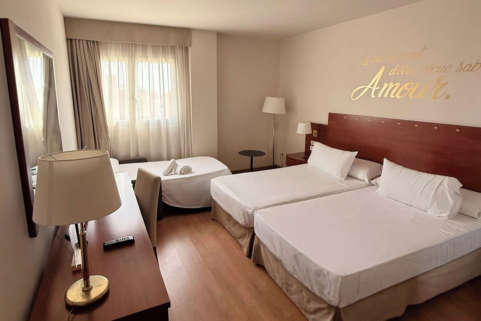 Double Room with Extra Bed | Minibar, in-room safe, desk, blackout drapes