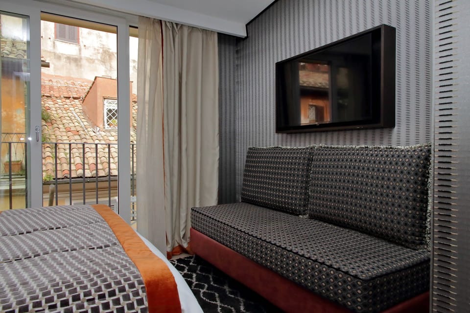 Exclusive Triple Room | Minibar, in-room safe, individually decorated, individually furnished
