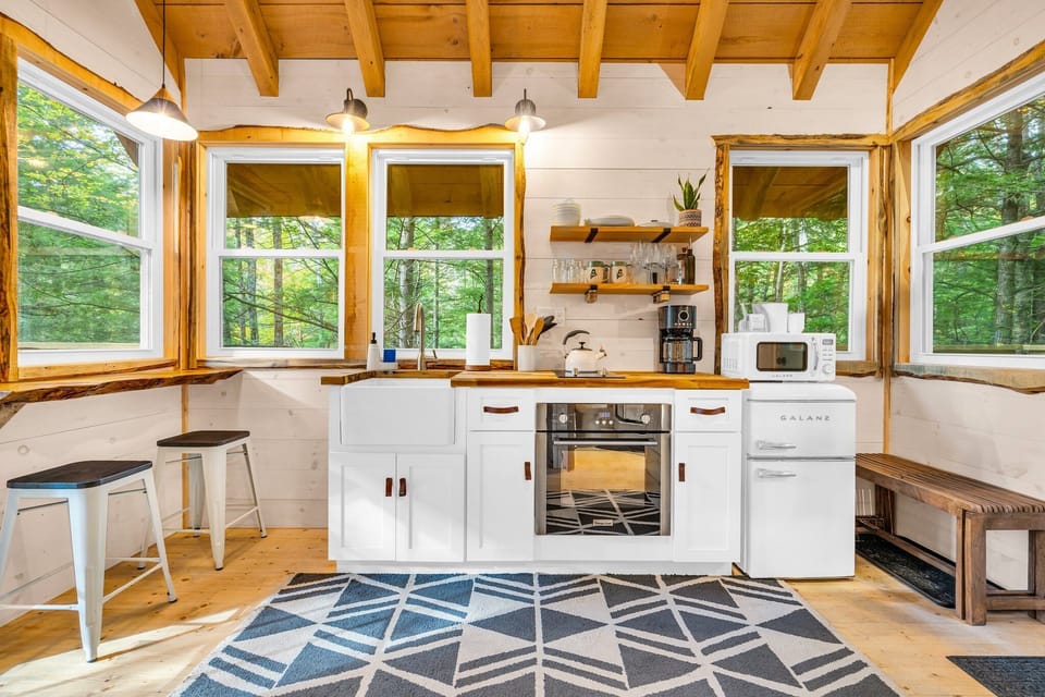 Fully equipped kitchen with oven, microwave, dinnerware for four, spices and oil