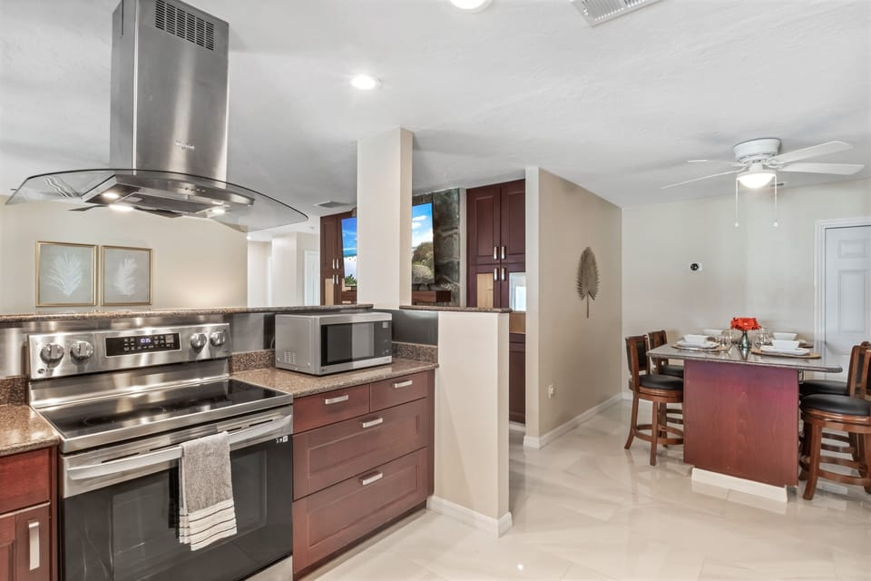 Designed for togetherness—our expansive kitchen opens to a welcoming living room, making it easy to entertain, enjoy meals, or relax without missing a moment.