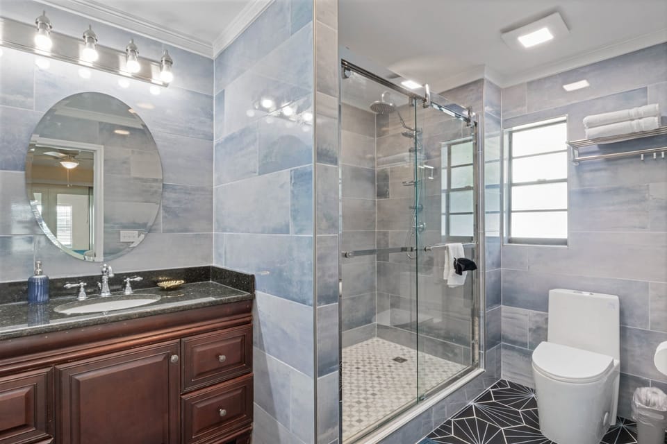Enjoy the privacy and convenience of the master ensuite, offering a stylish standing shower, and all the comfort you need after a day at the beach.