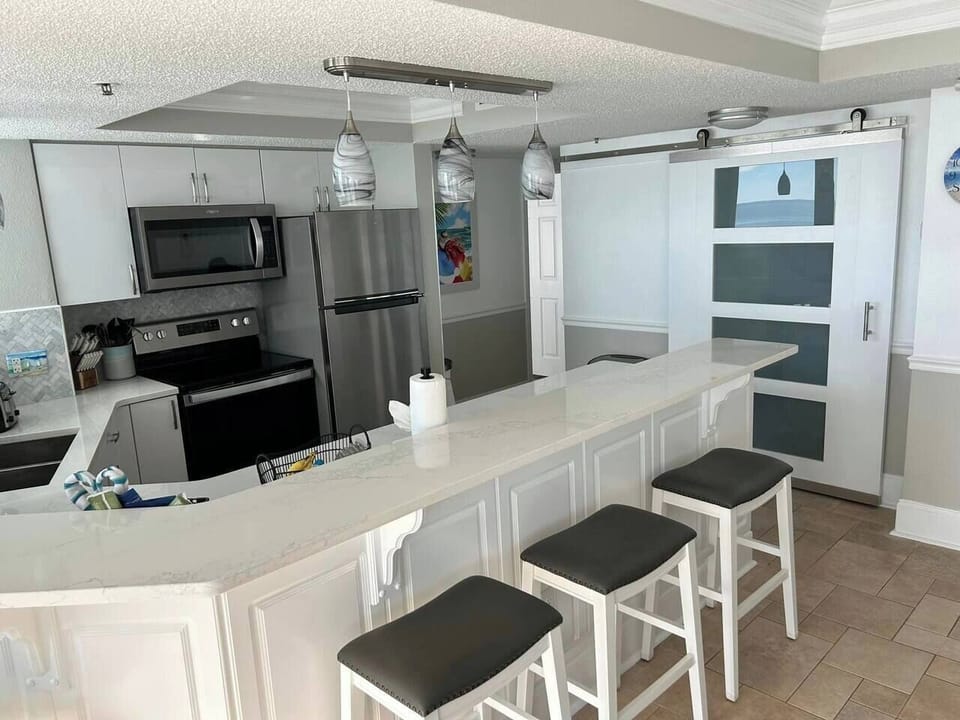 Kitchen with Sliding doors to Washer & Dryer