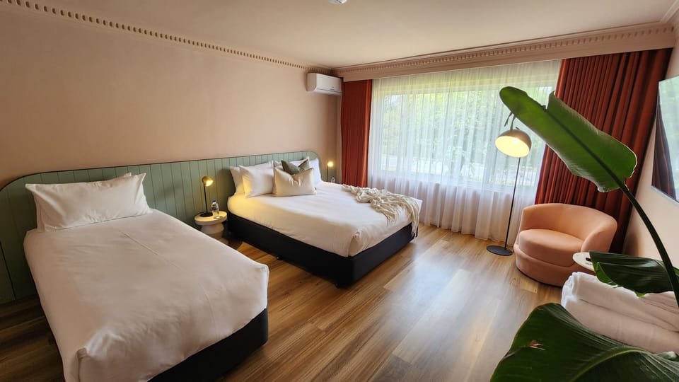 Queen Plus One | Premium bedding, blackout drapes, iron/ironing board, WiFi (free)