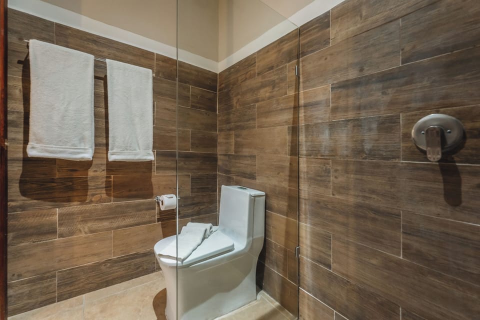 Standard Double Room | Bathroom | Shower, hair dryer, bathrobes, towels