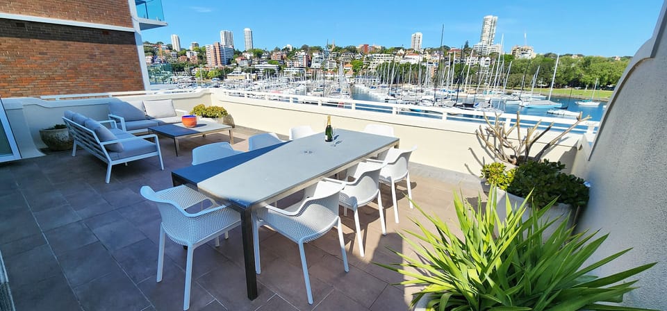 Private oversized outdoor terrace with harbour views.  Large umbrella.