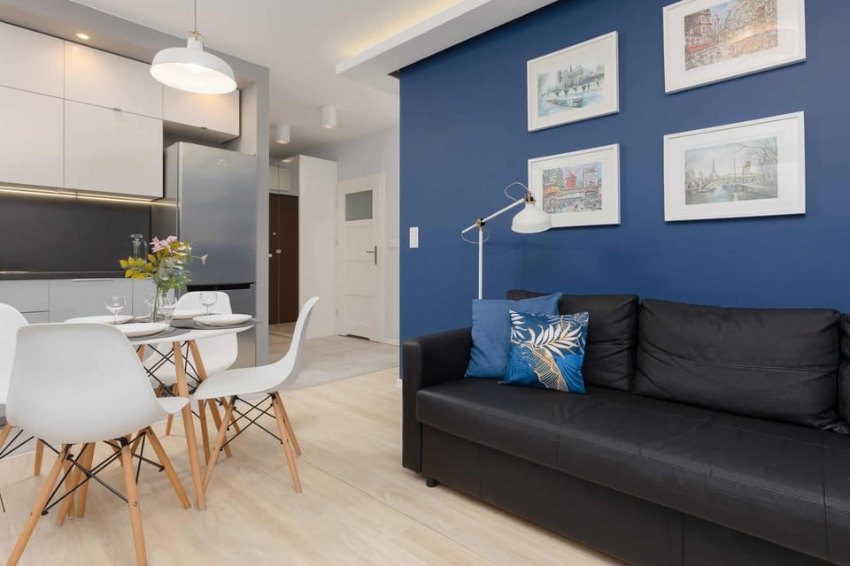 A wider view of the dining and living area, blending style and functionality seamlessly.

