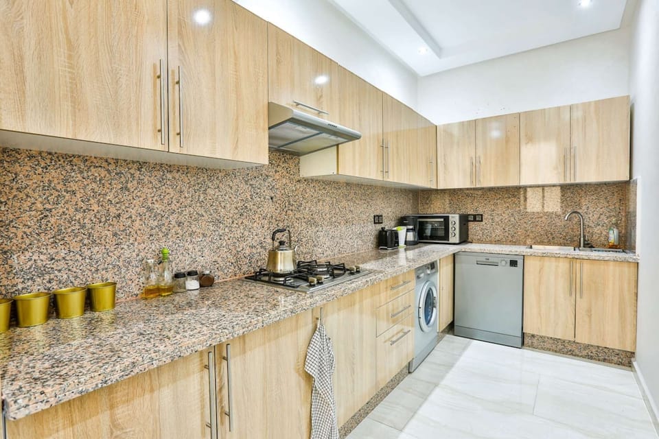 Fully equipped kitchen with dishwasher, plus in-unit washing machine.