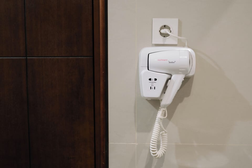 Shower, free toiletries, hair dryer, slippers