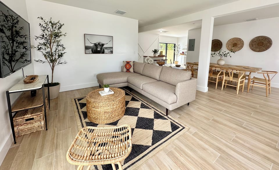 Living Room with a high end sectional and a 65” Smart TV