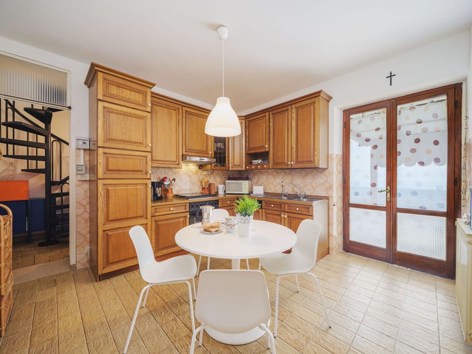 Table, Furniture, Property, Cabinetry, Countertop, Chair, Kitchen, Wood, Lighting, Interior Design