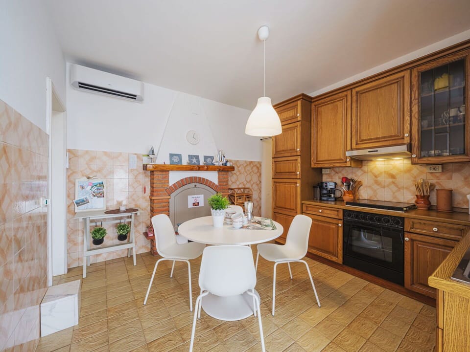 Furniture, Property, Cabinetry, Table, Countertop, Chair, Wood, Lighting, Flooring, Interior Design