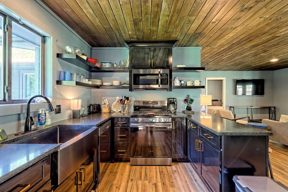 Brand new kitchen with gas stove, pots, pans, spices, and cutlery galore!