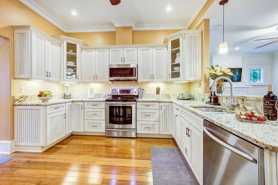 Full kitchen stocked with plates, cups, silverware, pots, pans, and everything you need to enjoy a home cooked meal!