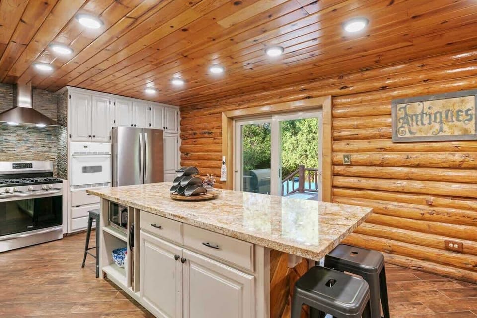 The kitchen has easy access to the back patio.