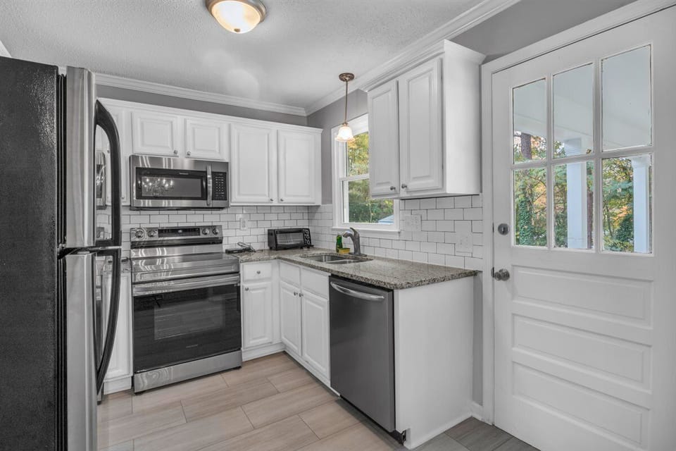 The kitchen leads you to The Patio Pad :)