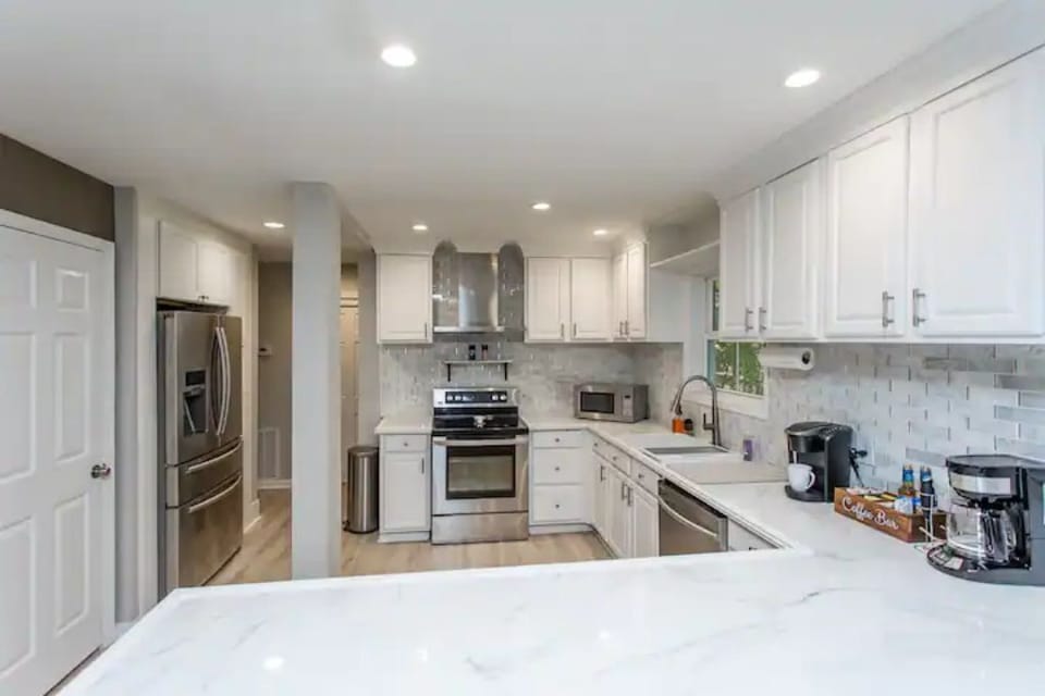Kitchen is fully stocked with large and small appliances