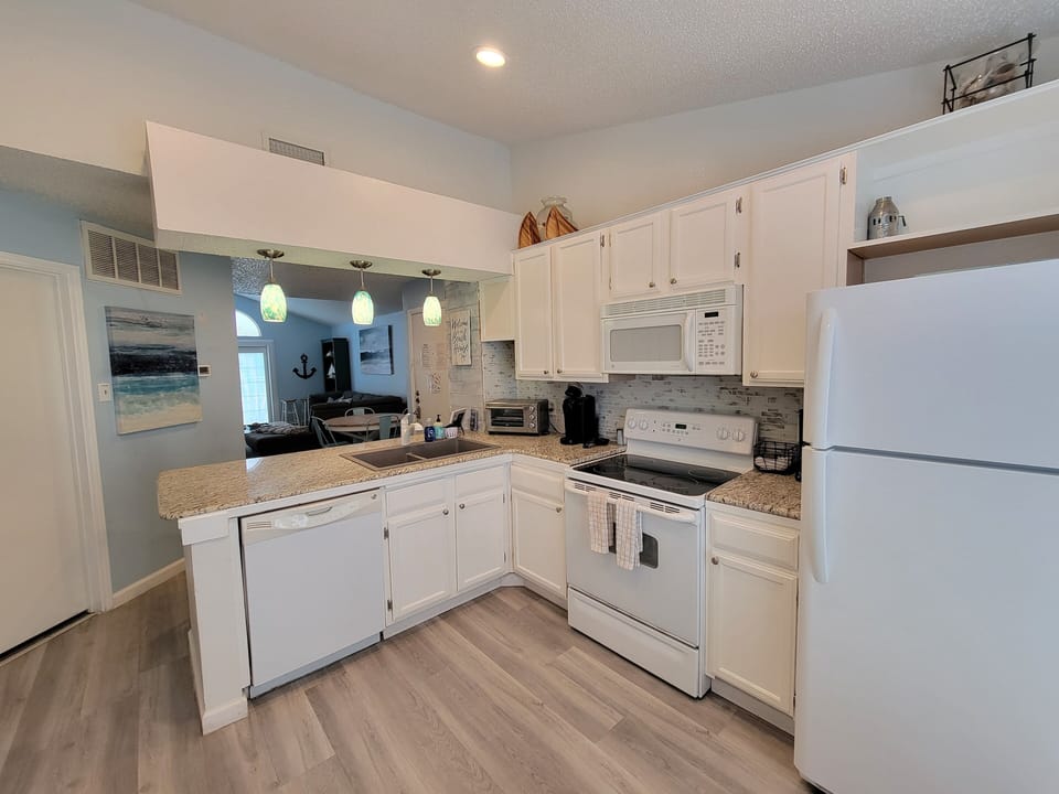 Kitchen has everything needed for cooking and dining