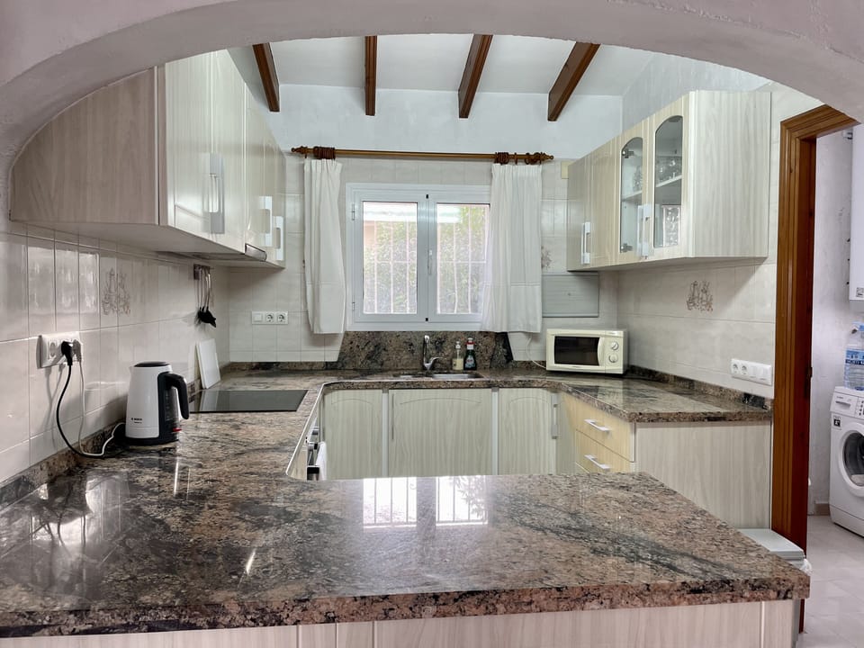 Kitchen leading to laundry 