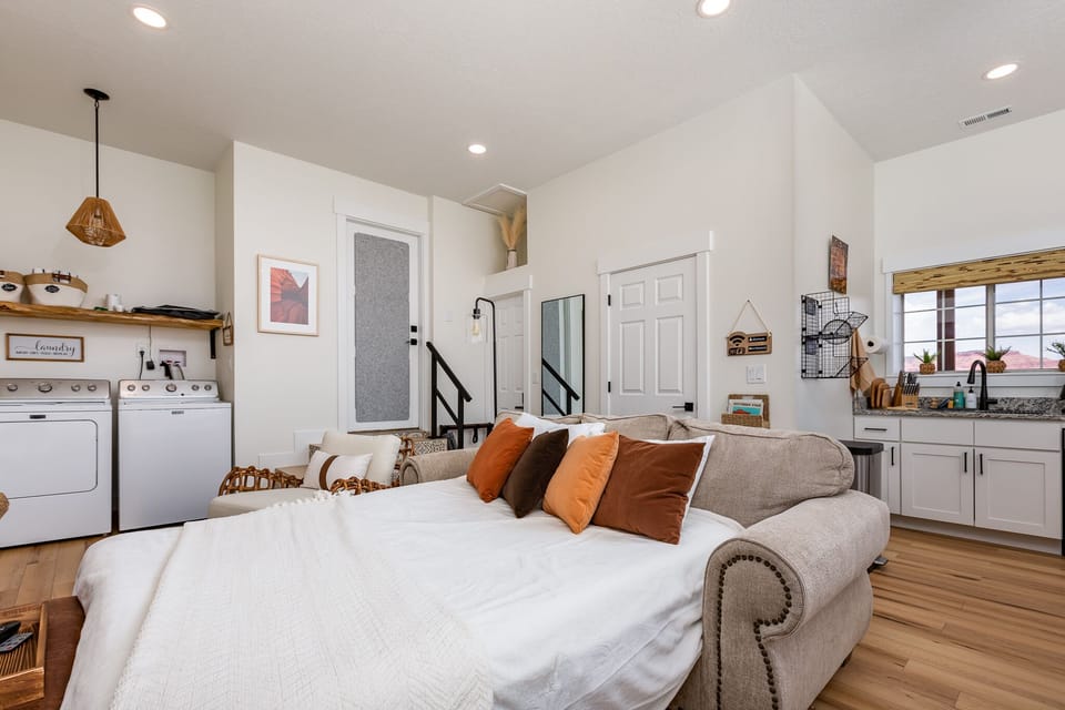 Couch unfolds to queen size bed with memory mattress.