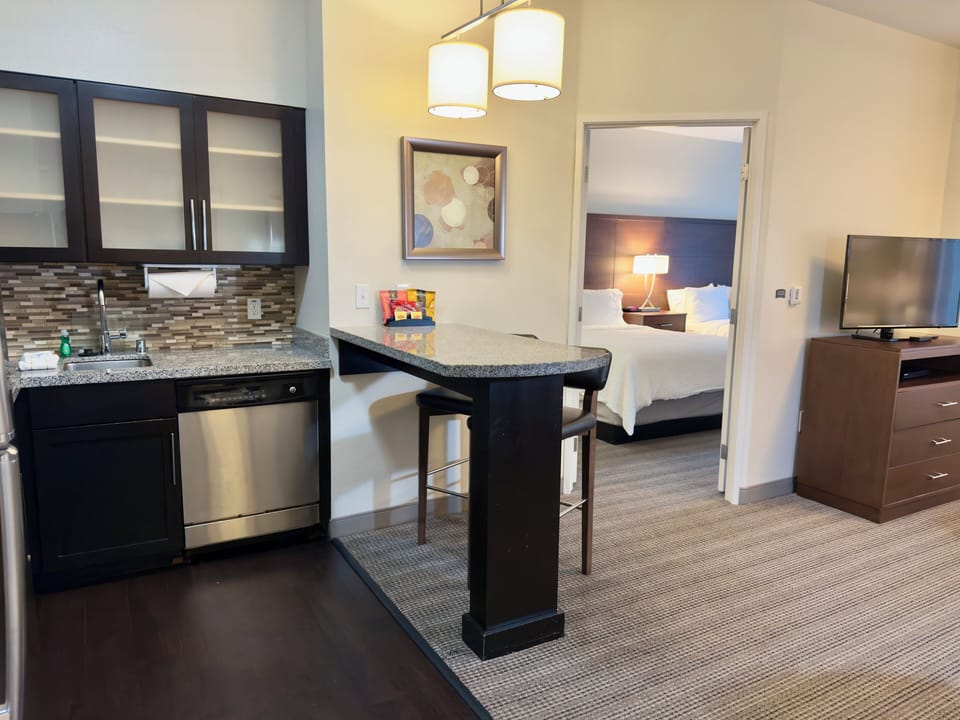 In-room safe, desk, iron/ironing board, cribs (free)