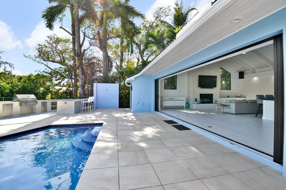 Huge sliding doors allow for seamless transition between indoor and outdoor living