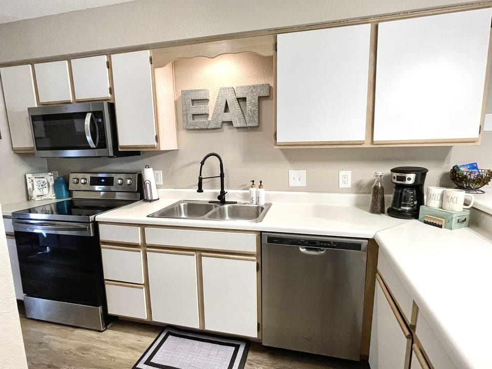 Stainless appliances, and a well stocked kitchen.