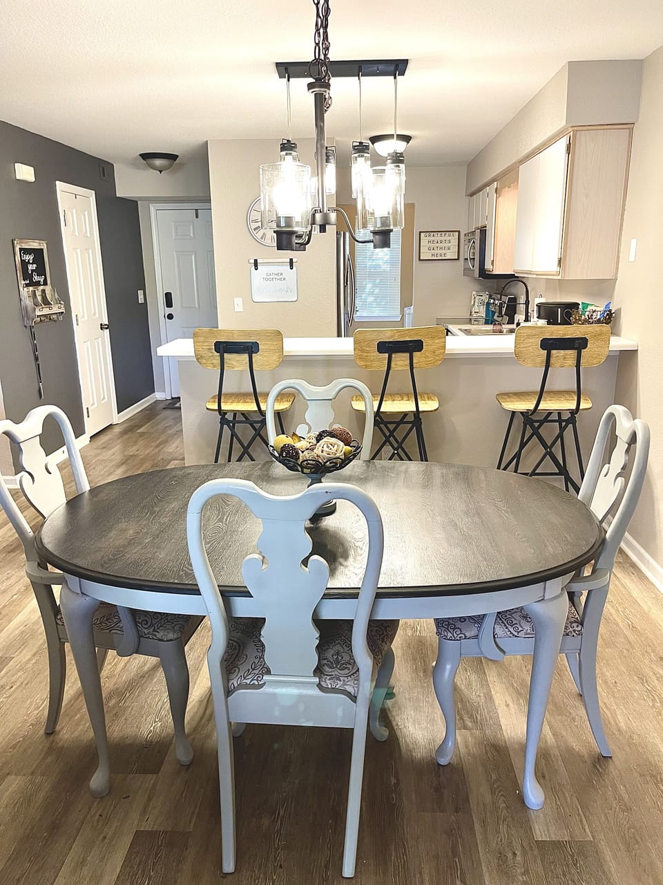 Table seats 6 (two additional chairs not pictured), with 3 bar seats