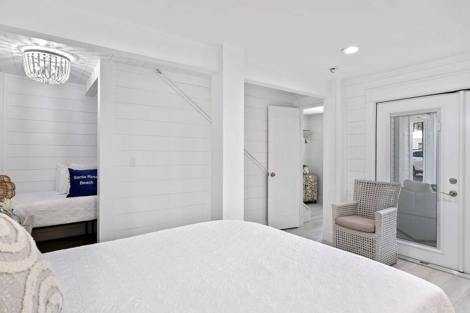 Open bedroom view flowing easily into the bathroom area.