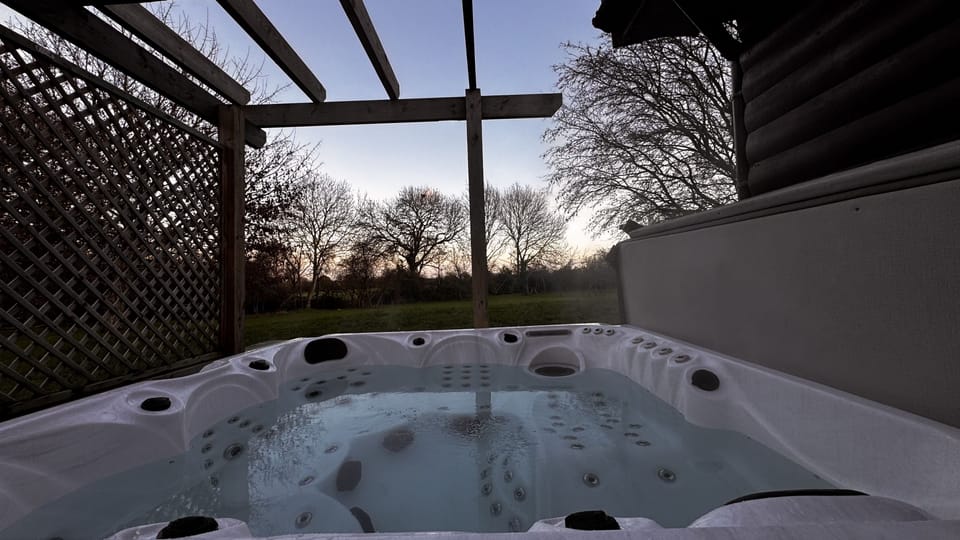Private five person hot tub with privacy screen