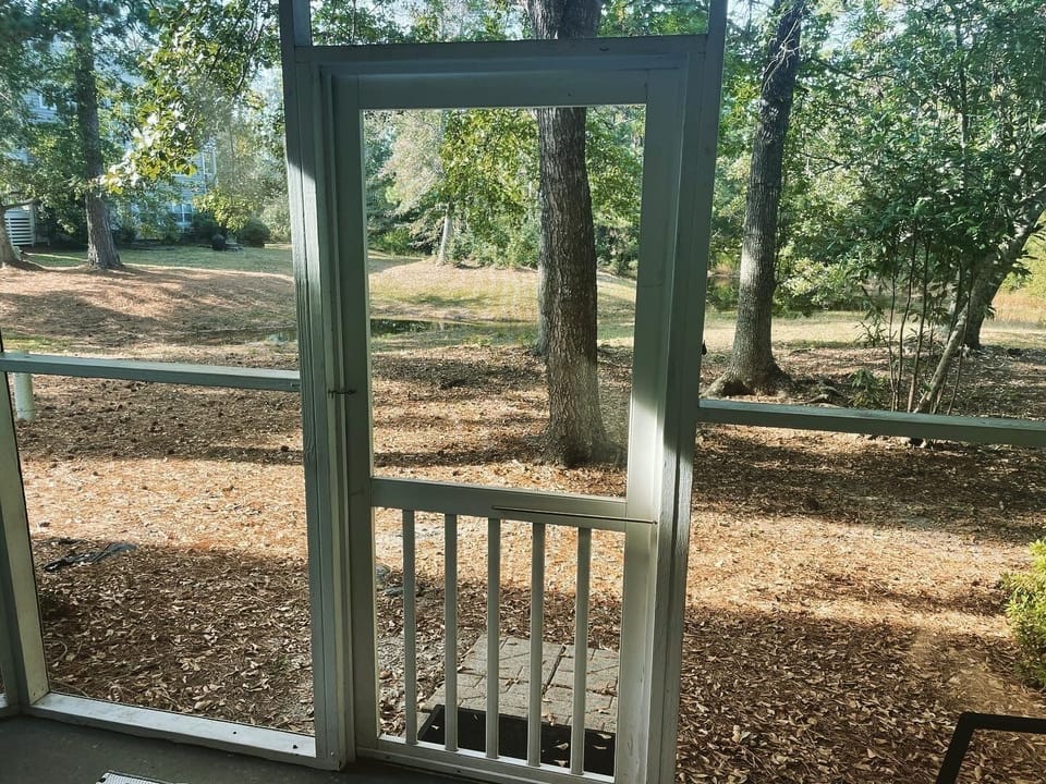 Porch overlooks a coastal pond for bird watching and enjoying the sounds.