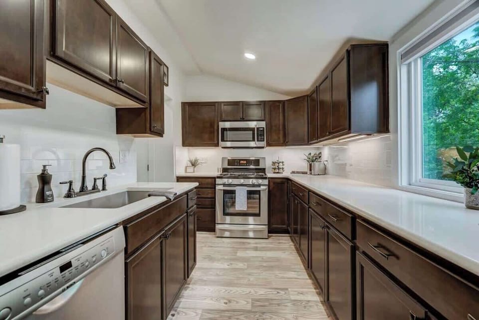 The kitchen is fully stocked with all the appliances, cooking utensils, mixing bowls, and everything else you could need for your stay!