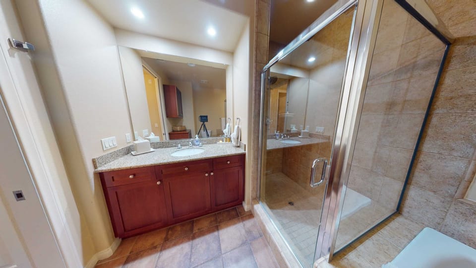 Bathroom w/ Single Vanity and Walk-In Shower