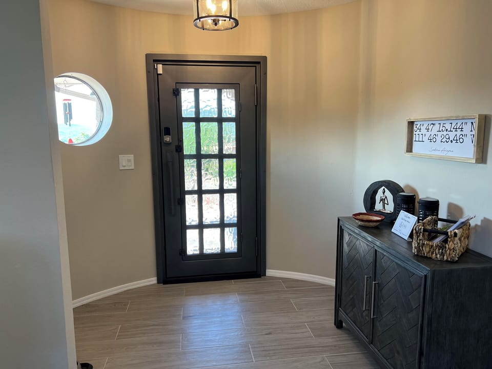 Glass framed front door lets lots of light in!