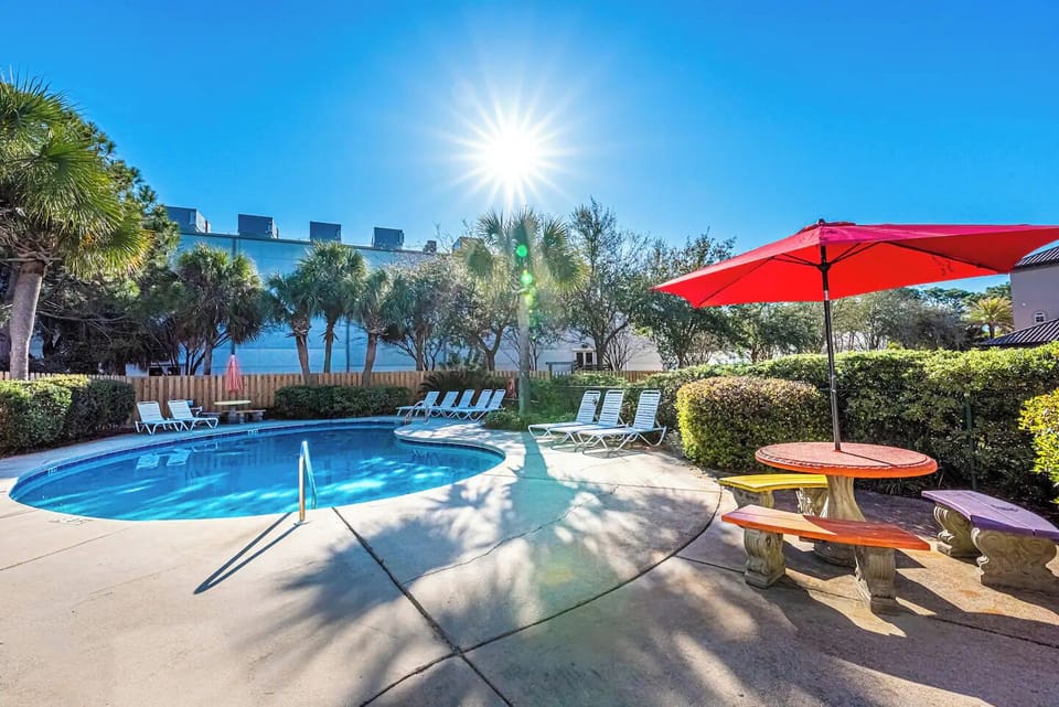 Bask in the Florida sun at the community pool, complete with lounge chairs, shaded seating, and a relaxing tropical vibe—just steps from your front door.
