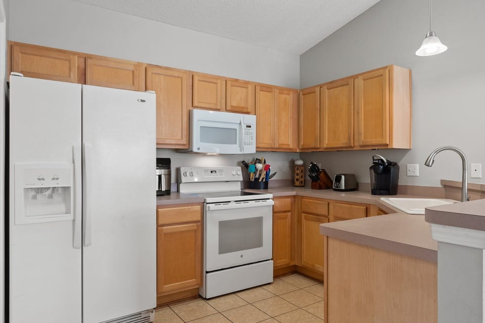 Fully equipped kitchen with modern appliances, ample counter space, and all the essentials—perfect for preparing home-cooked meals during your stay.