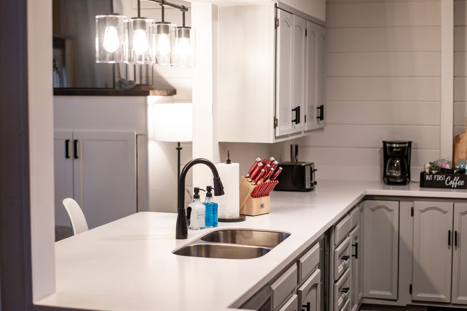 Kitchen features brand new counters, appliances, pots/pans, and silverware.