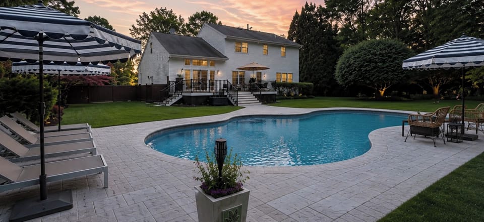 Resort inspired backyard with heated pool, outdoor seating, and complete privacy