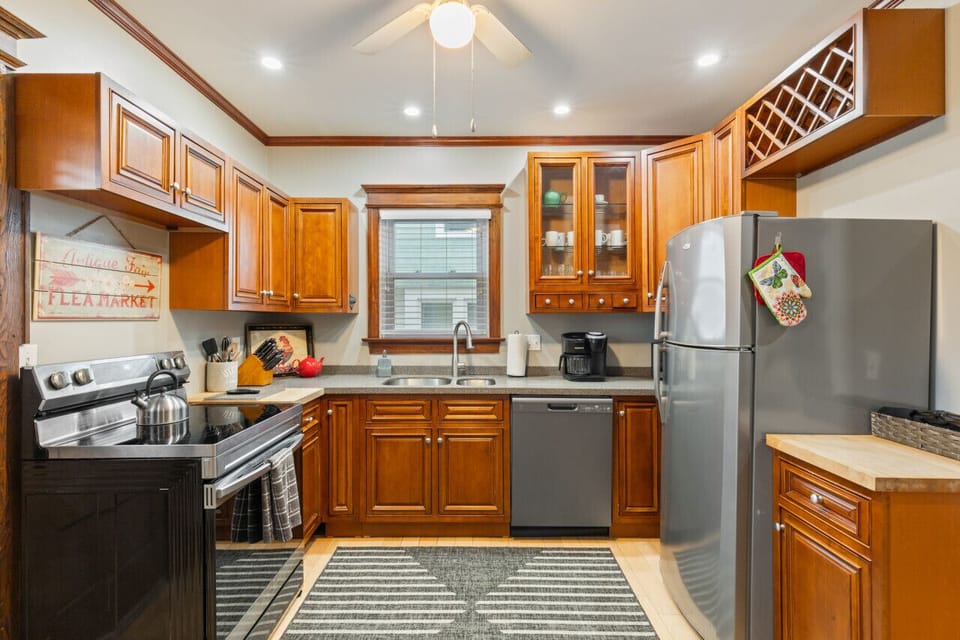 A chef`s paradise! Kitchen fully stocked with dishes, pots, pans and utensils.