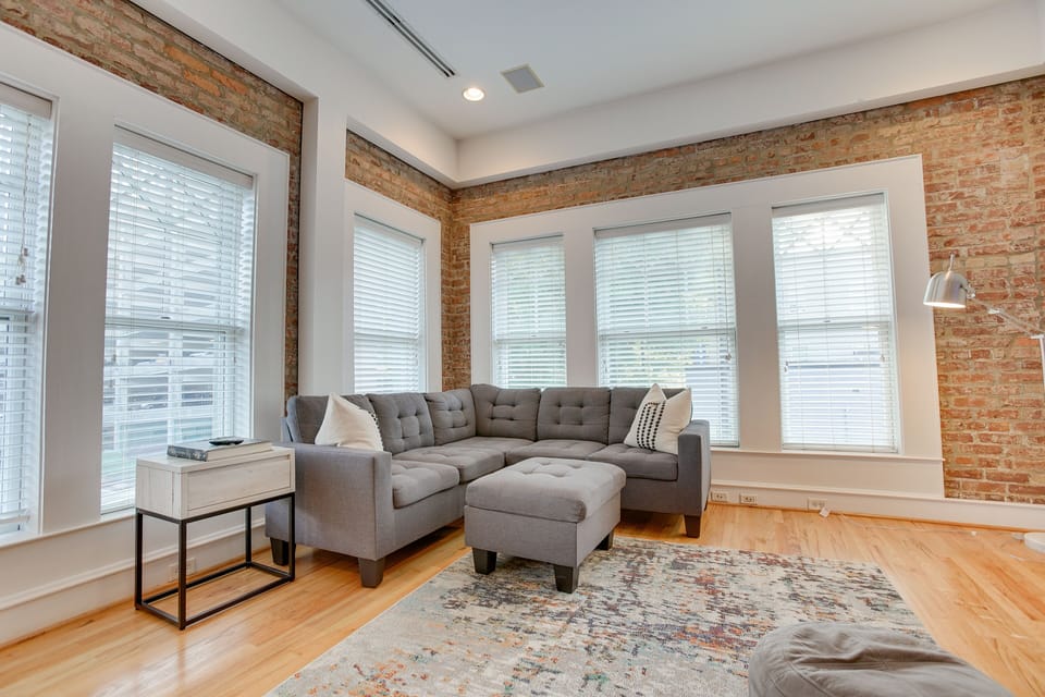 With beautiful views of Main Street, this living room is the perfect place to cozy up in after a day on the town!